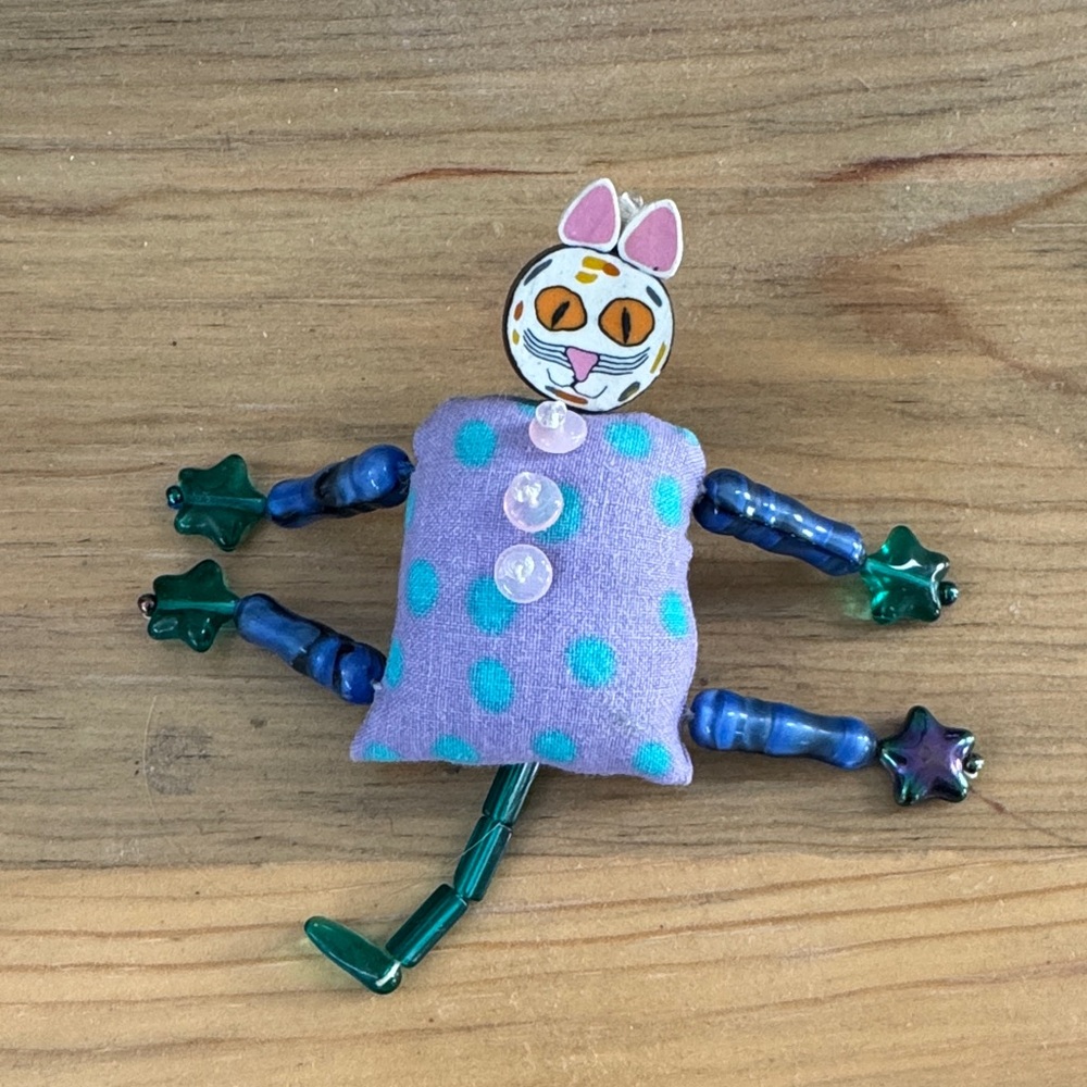 Whimsical Cat Brooch with Purple and Green Accents